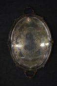 A large silver plated twin handled tray with engraved decoration.