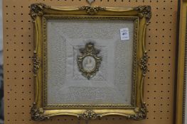 Miniature head and shoulders portrait of a lady, mounted with a lace handkerchief in a decorative