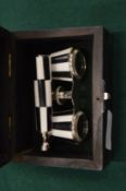 A boxed pair of opera glasses.