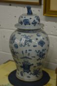 A large pair of Chinese blue and white temple jars and covers.