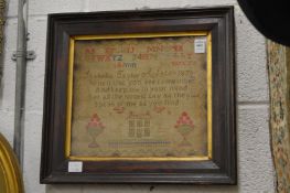 A 19th century framed and glazed sampler dated 1830.