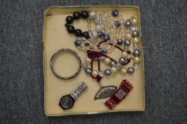 Bijouterie and a Swatch watch.