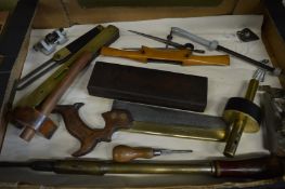 A collection of wood working tools to include an ebony and brass mortice gauge, brass back