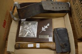 A fireman's presentation plaque together with an axe and belt.