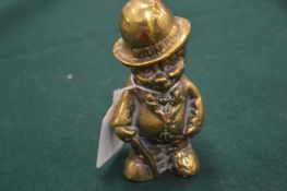 Heavy cast brass figure of a man in a hat.