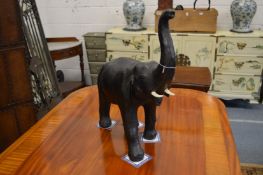 In the manner of Liberty & Co., a leather model of an elephant.