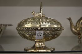 A plated butter dish with glass liner.