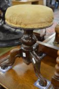 A Victorian walnut revolving music seat.