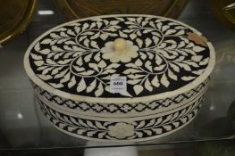 Bone inlaid oval box and cover.