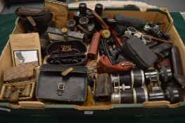 A collection of field glasses, opera glasses and other optical equipment.