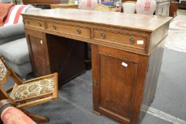 An oak pedestal desk.