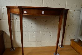 Reproduction mahogany serpentine fronted side table.
