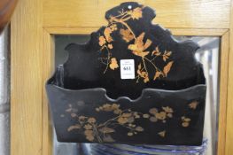 A lacquer wall mounted letter rack.