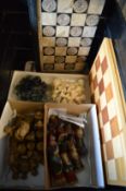 Various chess sets and boards.