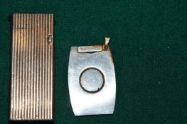 A Dunhill lighter and a cigar cutter.