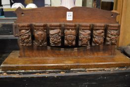 Carved wood pipe rack.