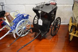 A good 1/8th scale scratch built model of a Hansom cab.