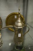 A plated brass Islamic ewer.