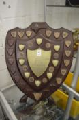 A shield shape golfing trophy, plaques dating from 1936 to 1978.