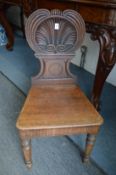 A Victorian mahogany hall chair.