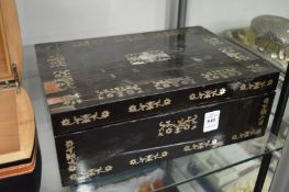A Victorian mother of pearl inlaid ebony sewing case with fitted interior containing several