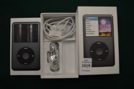 An Ipod Classic, boxed with paperwork.