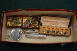 A box set of six dress studs, military badges etc.