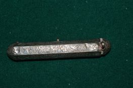 An Islamic engraved silver pendant.