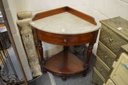 A Victorian mahogany and marble top corner washstand.