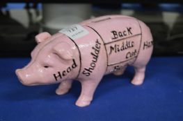 A novelty cast iron piggy bank.