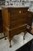 A miniature chest of drawers.