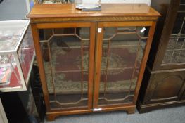 A mahogany two door bookcase.