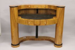 A VERY GOOD DECO DESIGN MAPLEWOOD OVAL SHAPED DESK fitted with three small drawers, leather