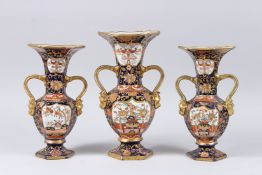 A MASONS IRONSTONE JAPANESE IMARI GARNITURE, comprising of a large twin handled vase and pair of