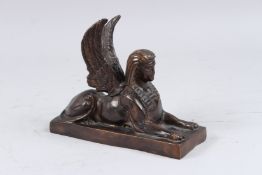 A GOOD BRONZE SPHYNX. 8ins long.