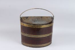 A BRASS BOUND MAHOGANY BUCKET with liner. 1ft.