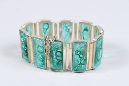 A SILVER AND ENAMEL BRACELET.