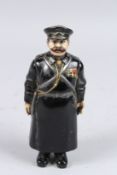 A RUSSIAN BRONZE POLICEMAN. Signed. 7.5ins high.