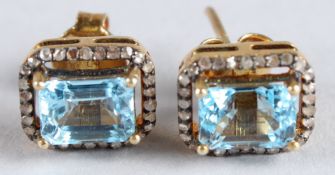 A PAIR OF SILVER GILT STUD EARRINGS set with step cut topaz and diamonds, boxed. Topaz 3.40ct