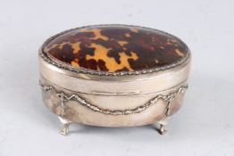 A VERY GOOD SILVER AND TORTOISESHELL OVAL JEWELLERY BOX with blue velvet lining. 6ins long. London