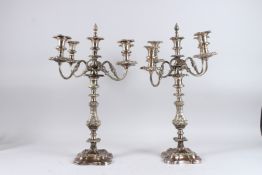 A LARGE PAIR OF FOUR BRANCH CANDELABRA. 28ins high.