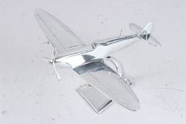 A CHROME SPITFIRE MODEL. 11ins long.