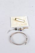 AN ENGRAVED SILVER BRACELET AND TIE CLIPS.