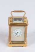 A MINIATURE CARRIAGE CLOCK. 2ins high.