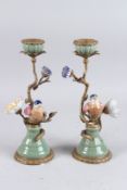 A PAIR OF BIRDS AND FLOWERS GILT CANDLESTICKS. 11ins high.