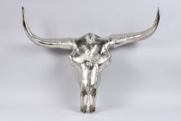 A BULL SKULL WALL HANGING.