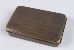 A BRASS COCAINE BOX.