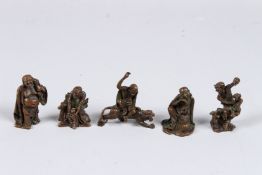 A SET OF FOUR SMALL CHINESE BRONZE FIGURES.