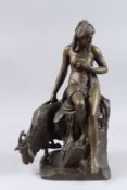 A BRONZE GROUP, NUDE AND GOAT. 17ins high.