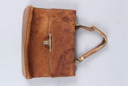 AN EARLY GUCCI LEATHER BAG. 10ins high.